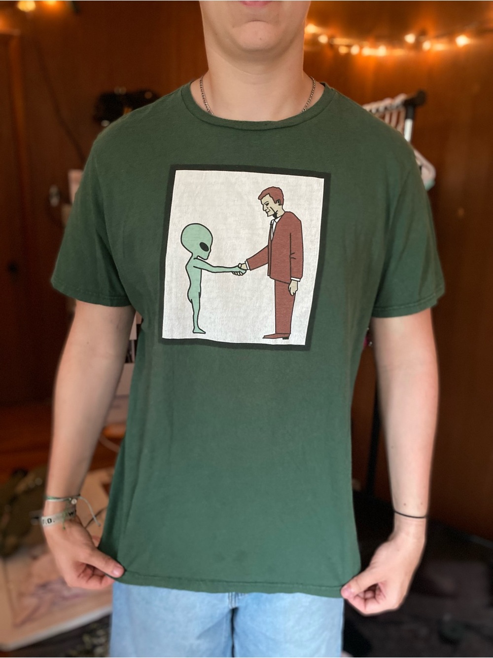 Green Graphic Tee with Alien Handshake